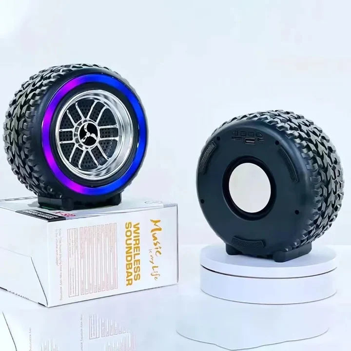 Two unique speaker designs resembling wheels on a white background with a box labeled 'Music Wireless Soundbar'.