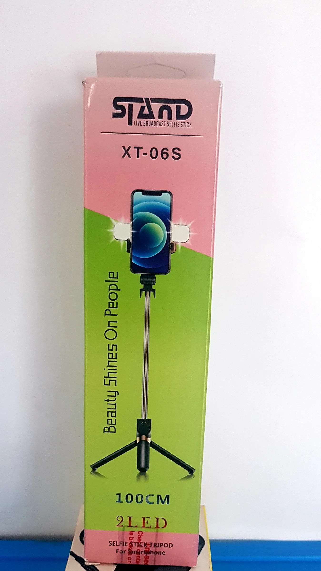 Product packaging for a smartphone stand with branding and specifications on a white background