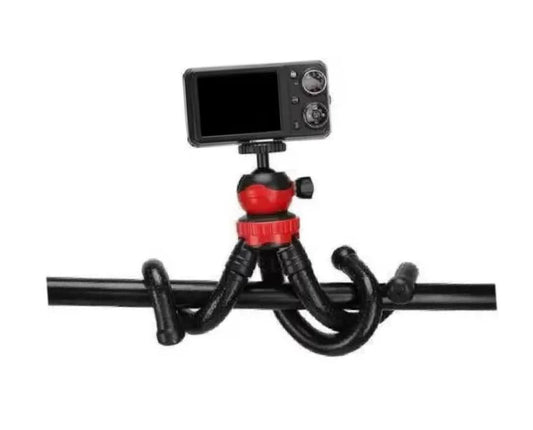 Camera mounted on a flexible tripod with a white background