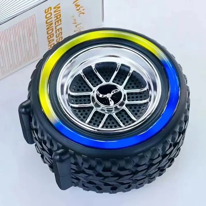 Tire-shaped speaker with colorful rim on a white background