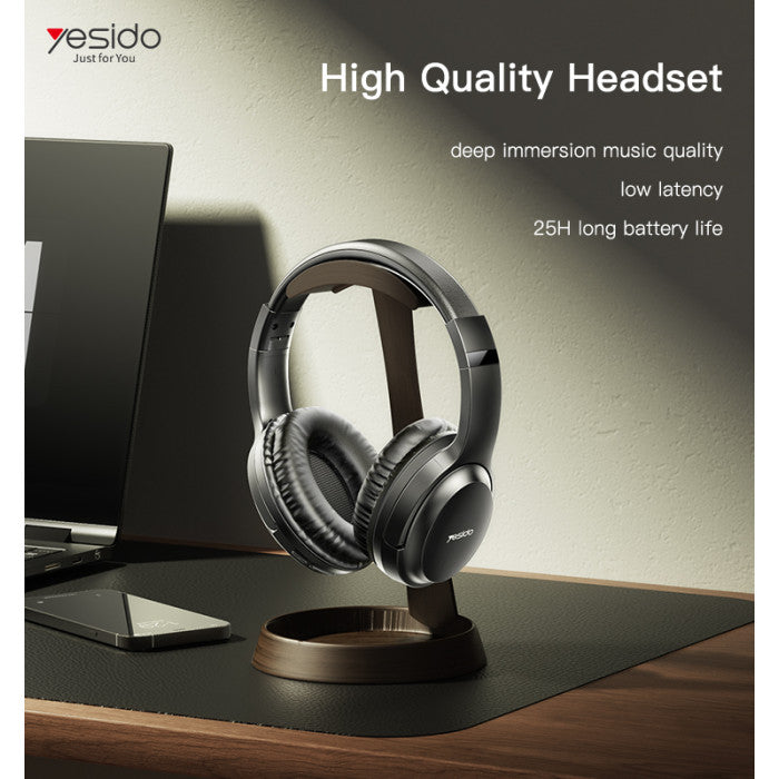 High-quality headset on a stand with laptop and phone in the background, featuring Yesido branding.