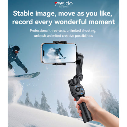 Hand holding a smartphone with a gimbal stabilizer, snowboarder in the background, and Yesido branding.