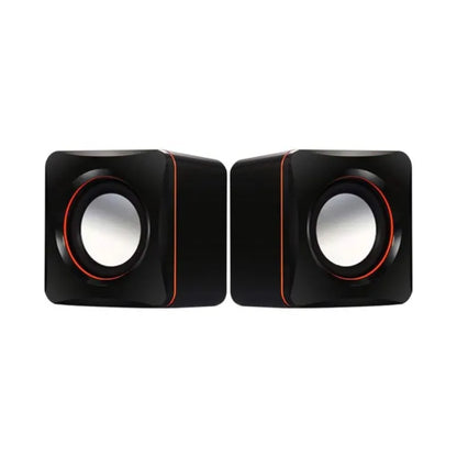 Pair of black speakers with red accents on a white background