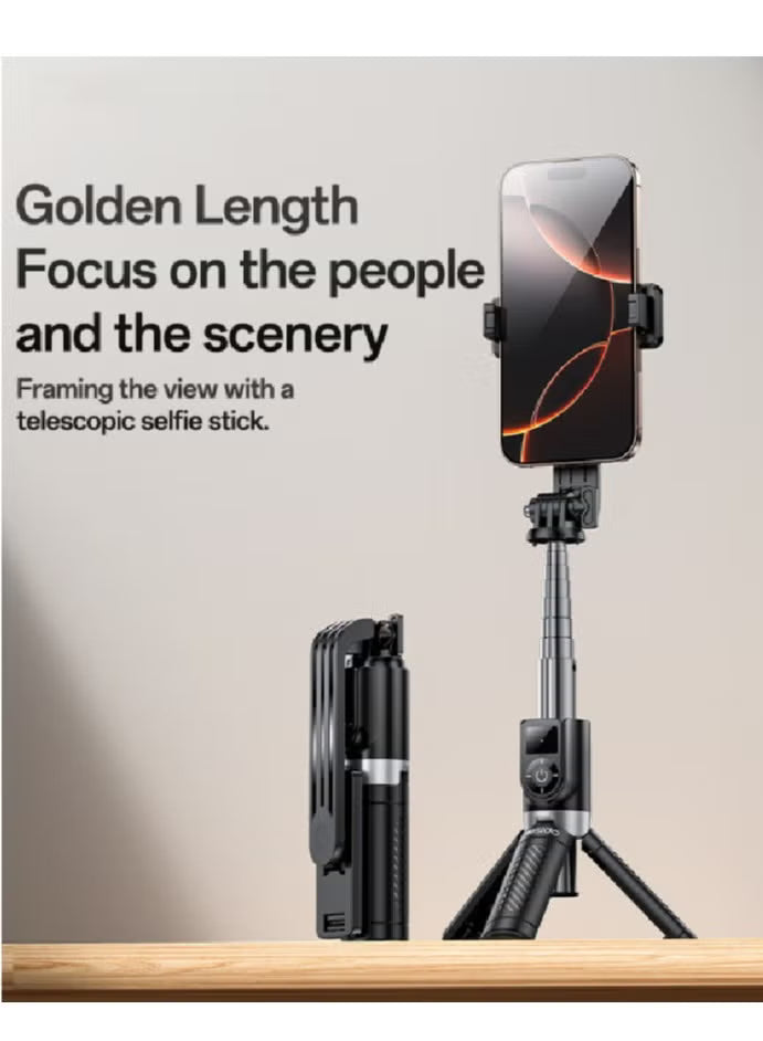 Telescopic selfie stick with phone holder on a wooden surface and light background