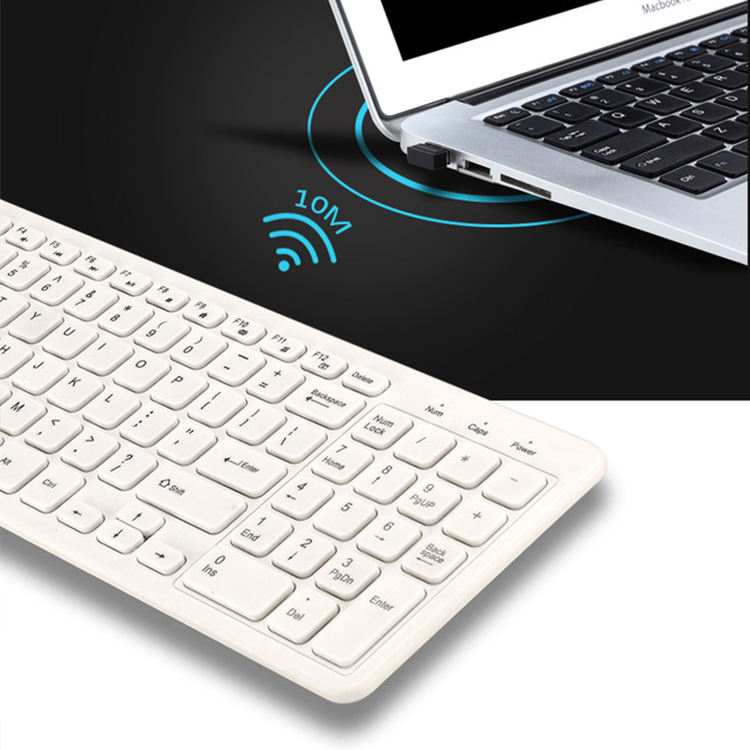 Wireless keyboard with a laptop on a black background, showing a 10-meter range indicator.