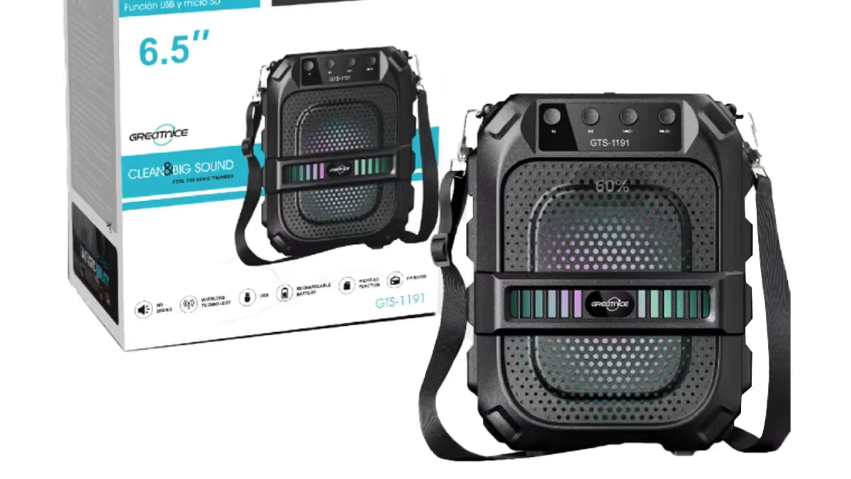 Portable speaker with strap and packaging on a white background