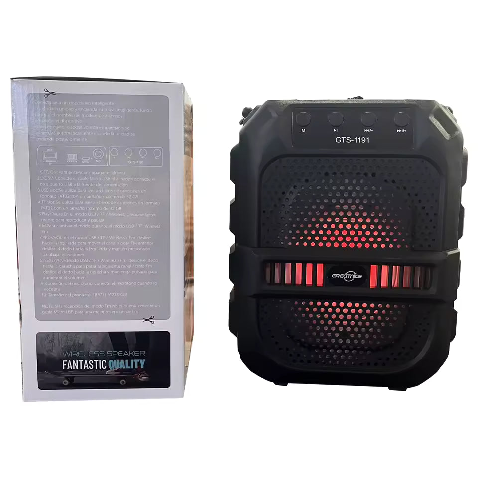 Black wireless speaker with red LED lights next to its packaging on a white background