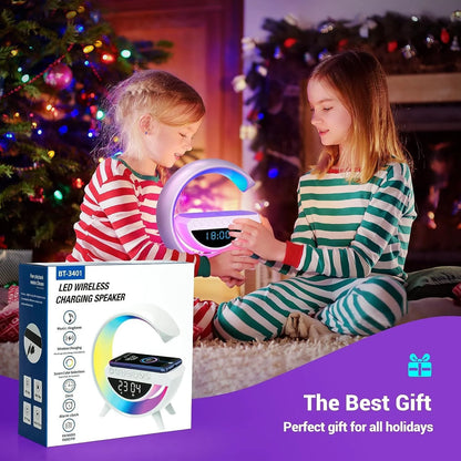 Two children playing with a LED wireless charging speaker in a festive setting, with the product packaging visible.