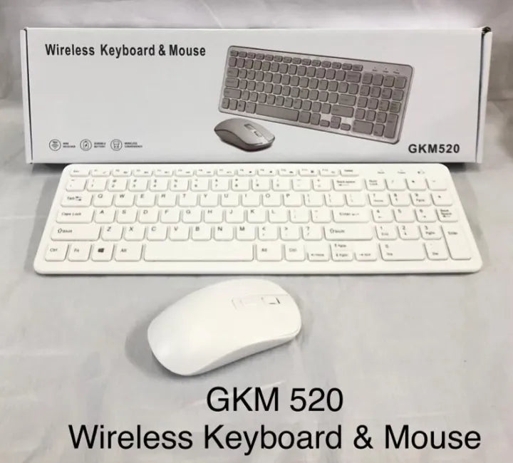 White wireless keyboard and mouse set with packaging on a light gray background