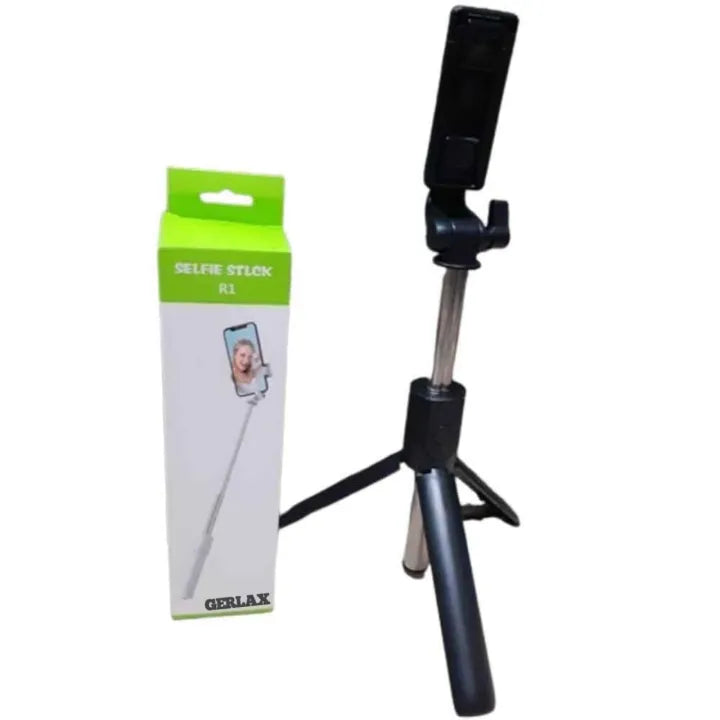 Black selfie stick with adjustable tripod and packaging on a white background