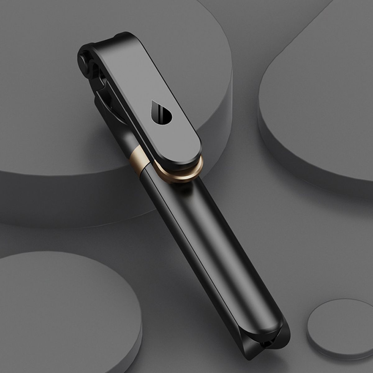 Black and gold Bluetooth headset on a dark gray background