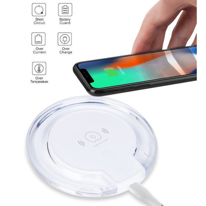 Wireless charging pad with smartphone on a white background