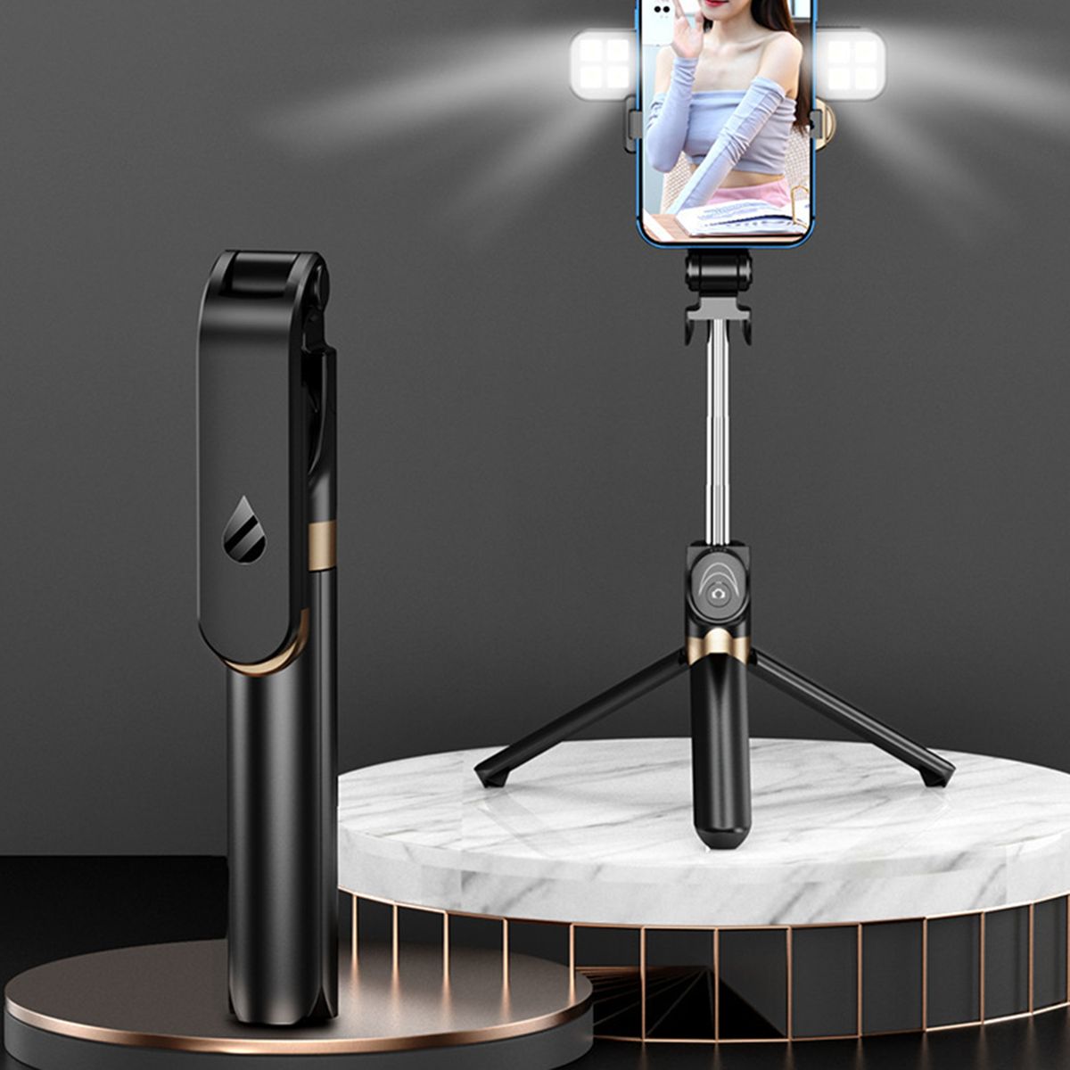 Black smartphone holder with remote control on a marble platform against a dark background